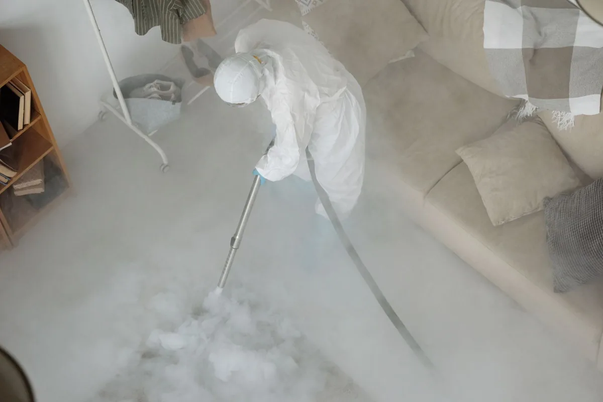 Biohazard cleanup technician in protective equipment, The Dominion, San Antonio, TX